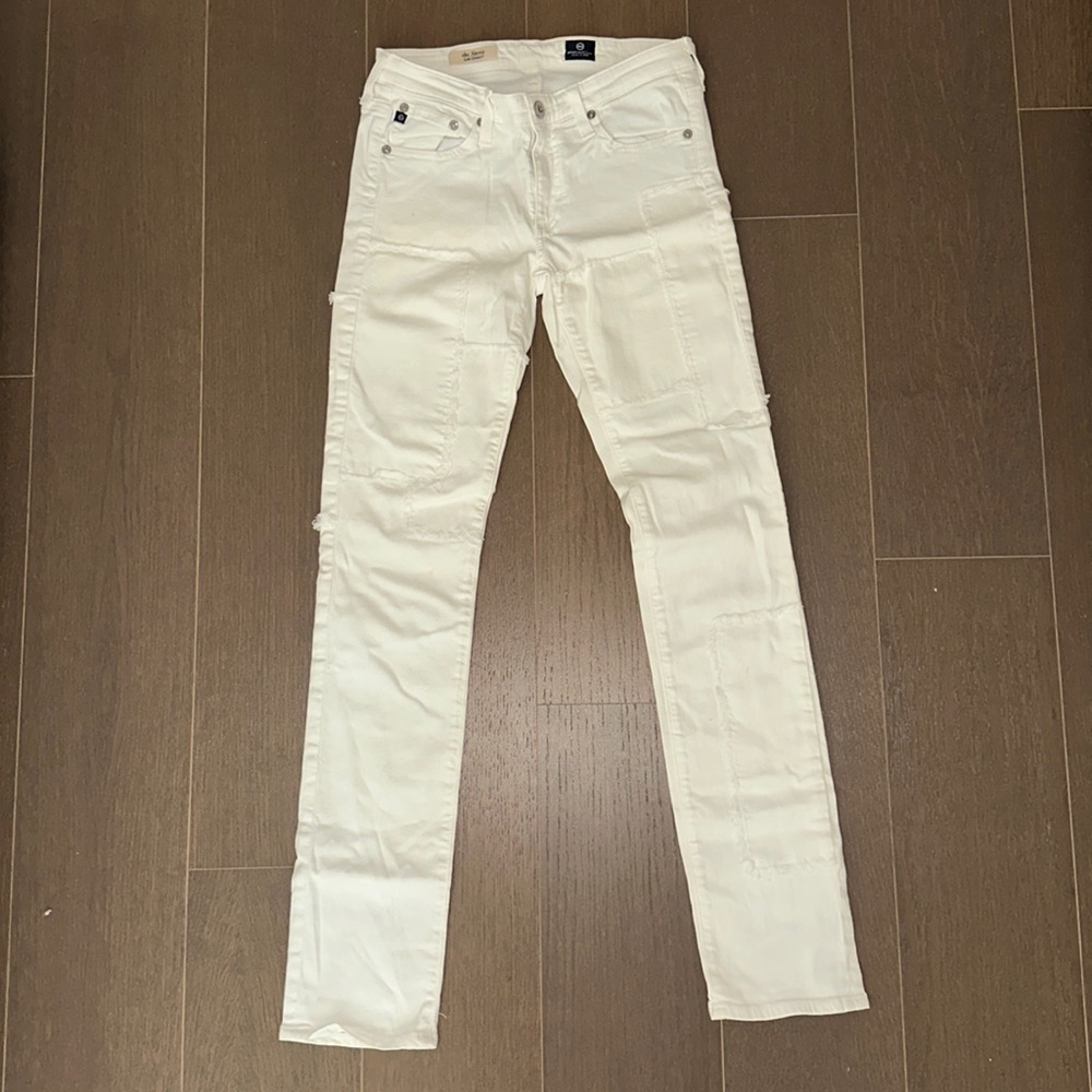 AG slim straight white patched jeans